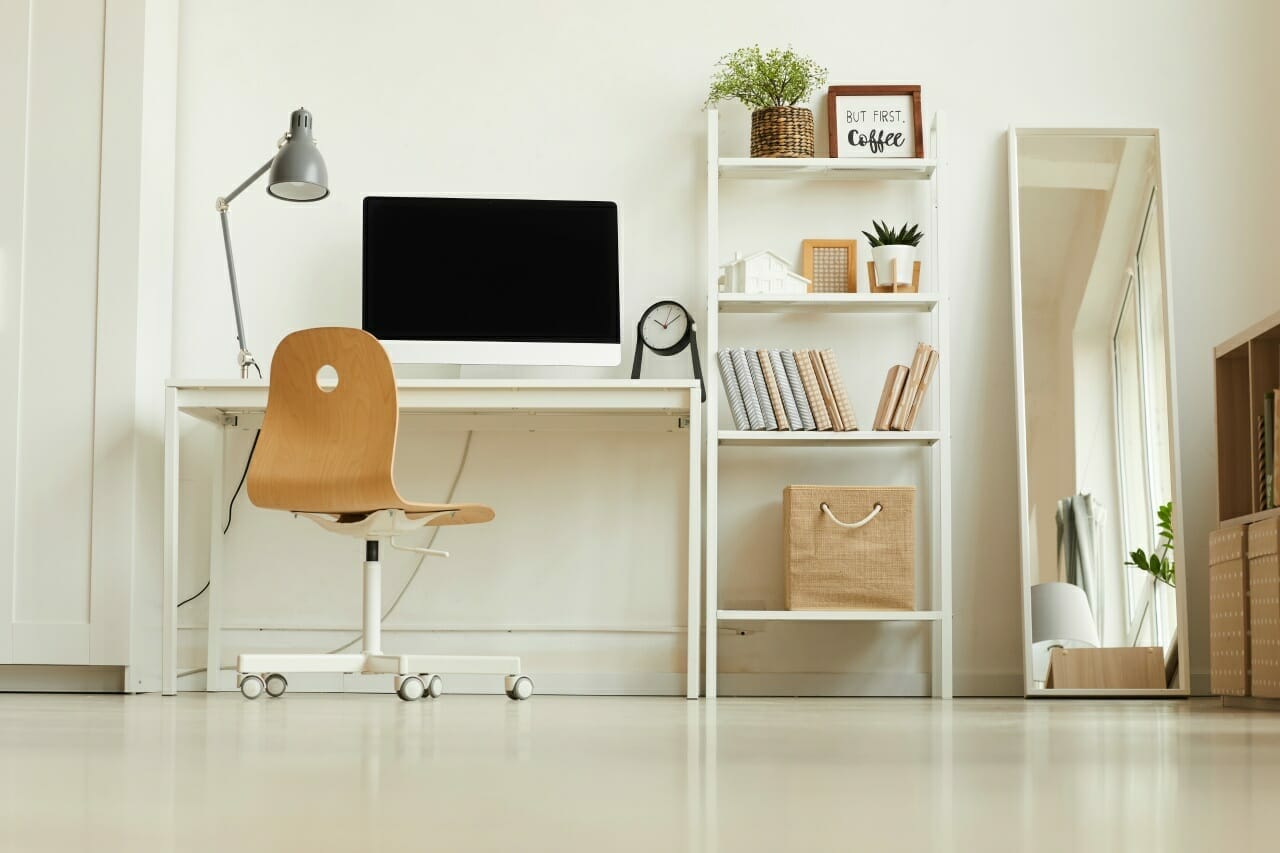 low-angle-view-at-all-white-modern-interior-with-focus-on-empty-home-office-workplace