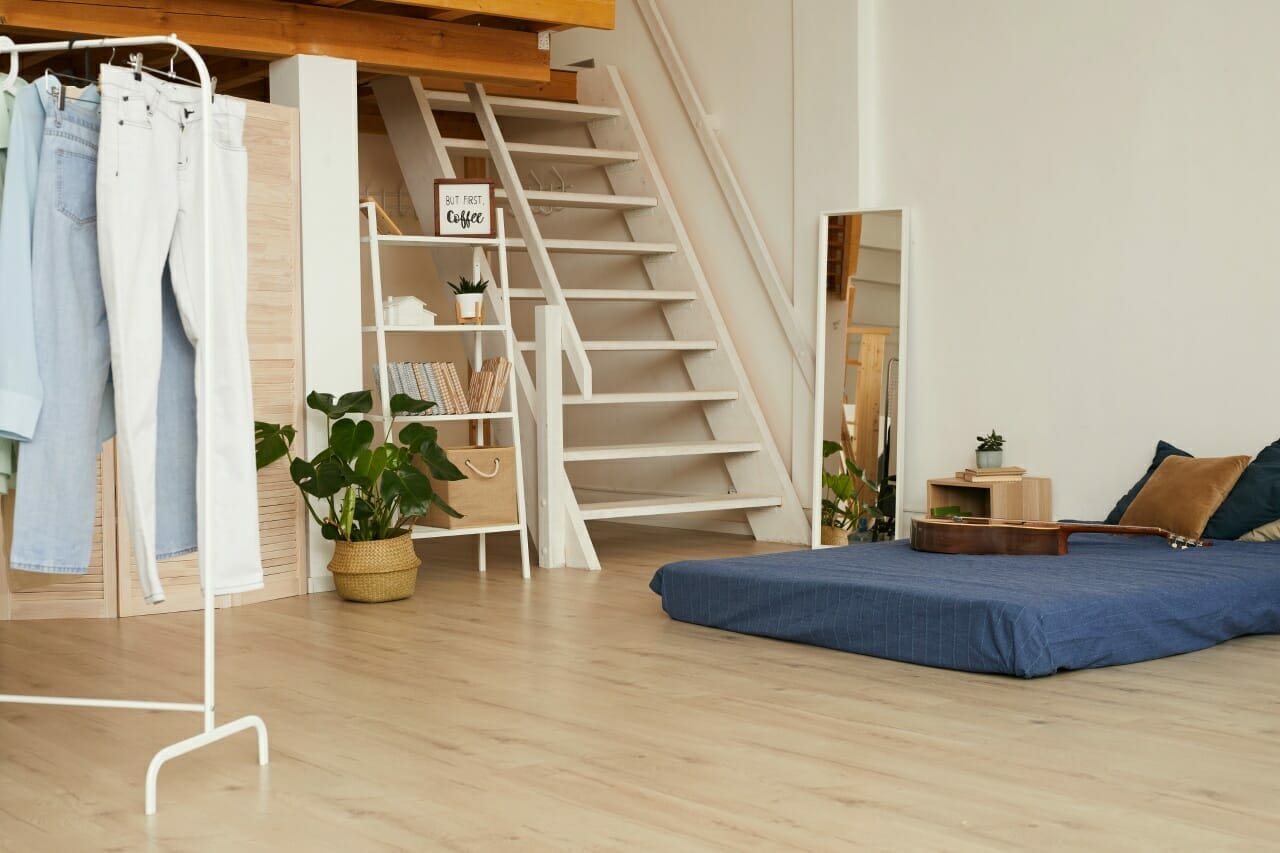 minimal-bedroom-interior-with-low-bed-and-wooden-flooring