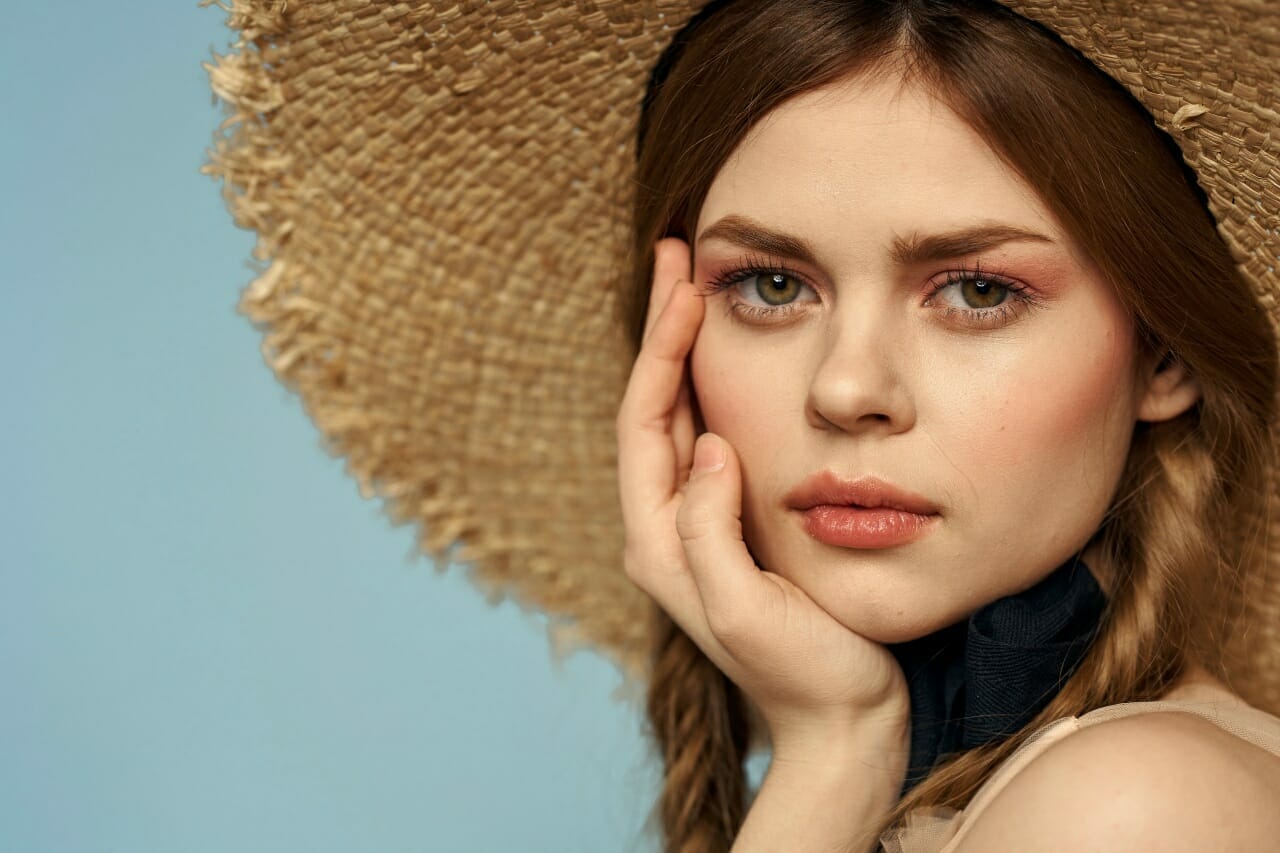girl-in-a-straw-hat-portrait-close-up-pigtails-fun-red-hair