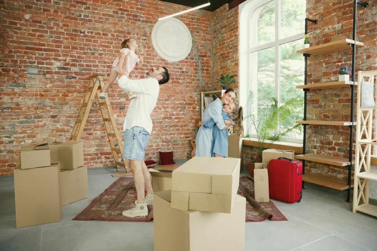 new-life-adult-family-moved-new-house-apartment-spouses-children-look-happy-confident-moving-relations-new-life-concept-unpacking-boxes-with-their-things-playing-together