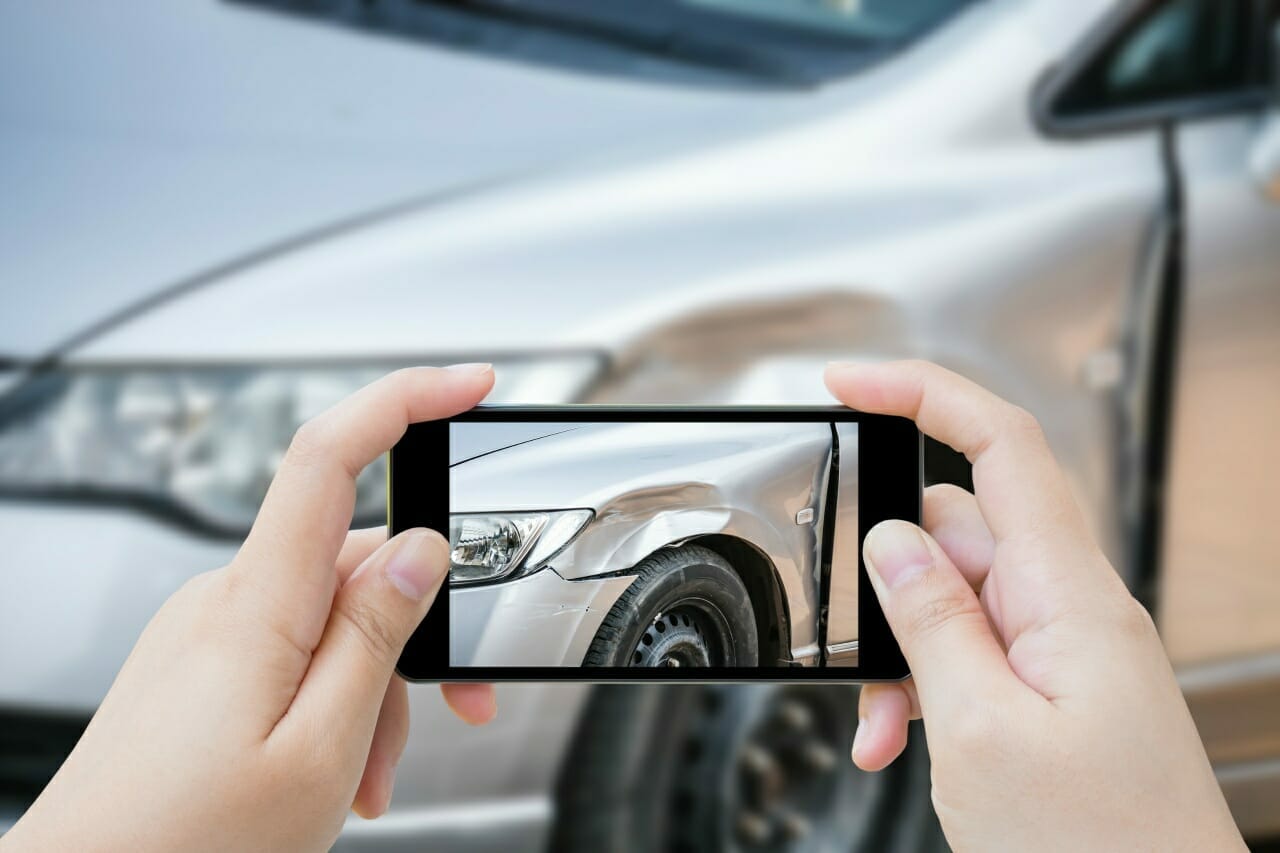 woman-using-mobile-smartphone-take-photo-car-crash-accident-of-the-damage-to-the-car-for-accident-insurance