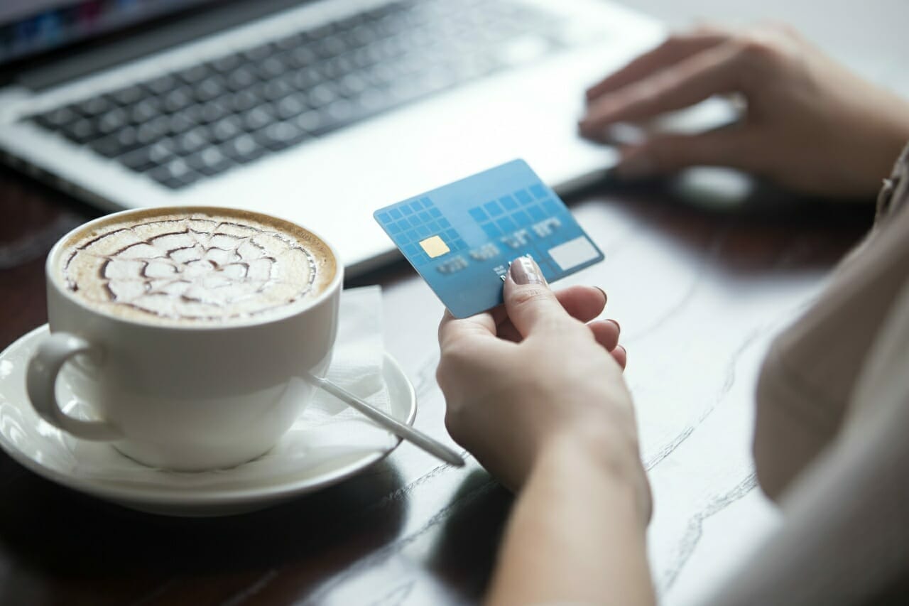 modern-woman-using-credit-card-for-online-payment-close-up
