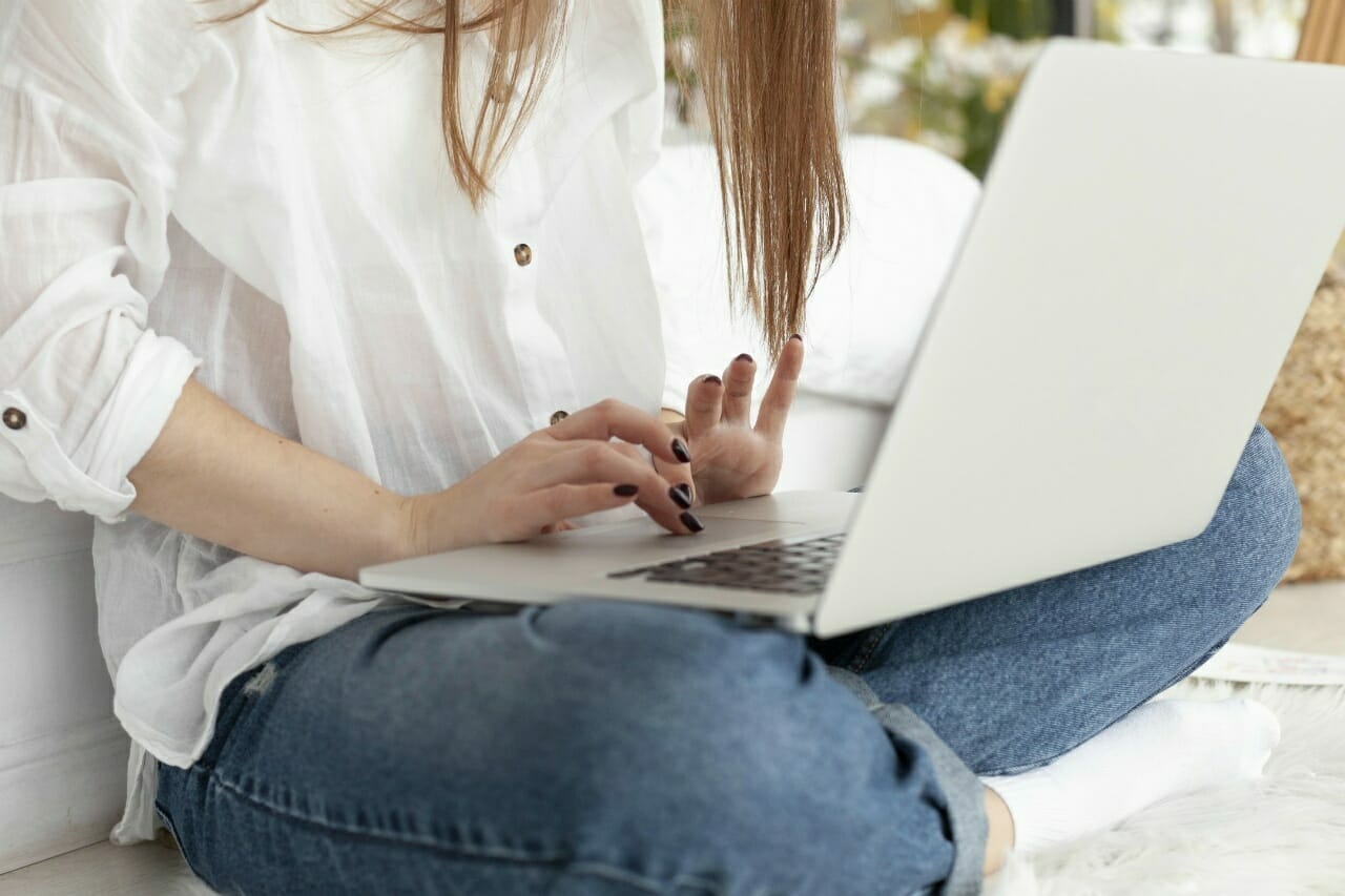woman-working-with-her-laptop-her-lap